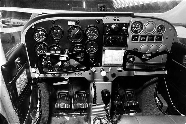 The flight controls in the cockpit of a Cessna light aircraft