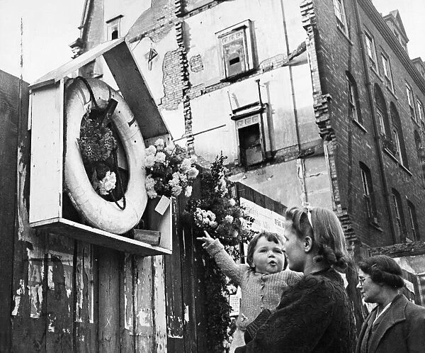 Floral tributes from neighbours, on the anniversary of The Blitz on flats in Stoke