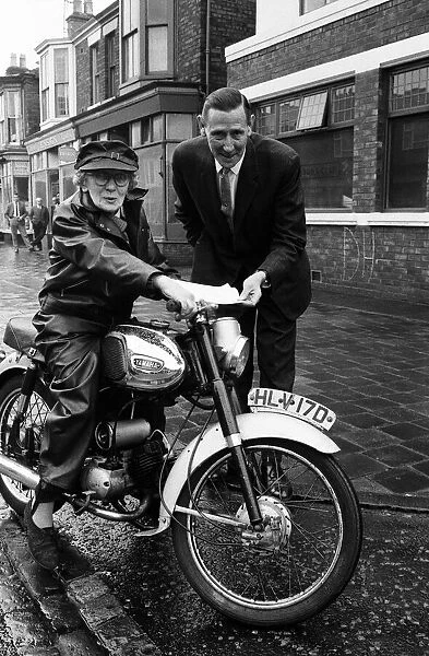 Florrie Ball, 77, is given a cover note for her insurance for her motorbike insurance by