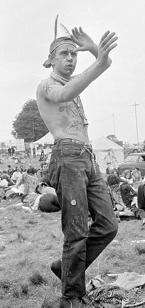 Flower Power festival at Woburn Abbey, August 1967 A hippy dressed with feathers in