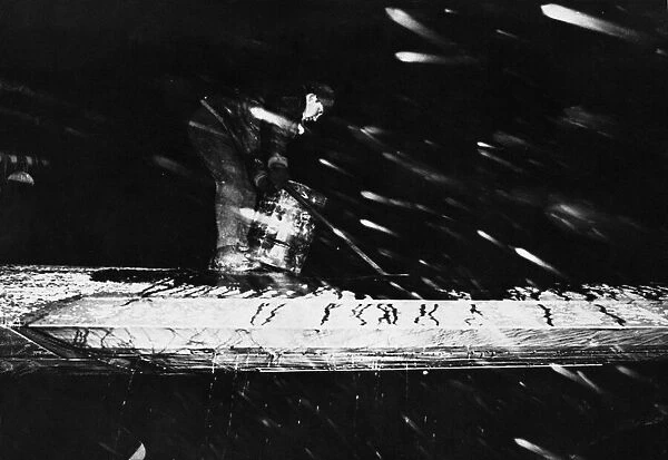 US Flying Fortress takes off in blizzard. M  /  Sgt Mike Borrett scrubs ice off a wing