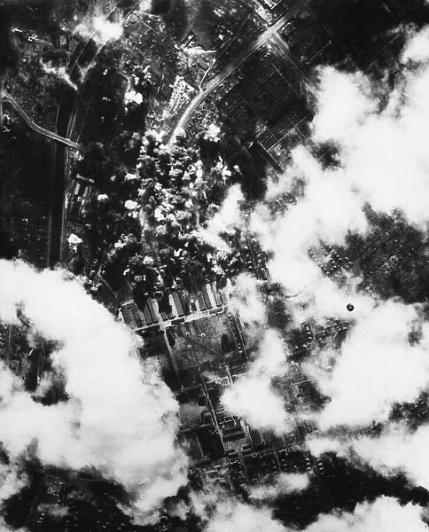 Flying Fortresses and Liberator bombers of the 8th Air Force attack industrial targets