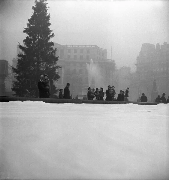 Foam in Trafalger Square Fountains. December 1952 C6390