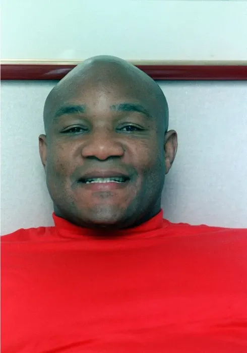 Framed Print : Fomer boxing champion George Foreman in a London hotel resting on bed September 1990 Framed Print : Fomer boxing champion George Foreman in a London hotel resting on bed September 1990