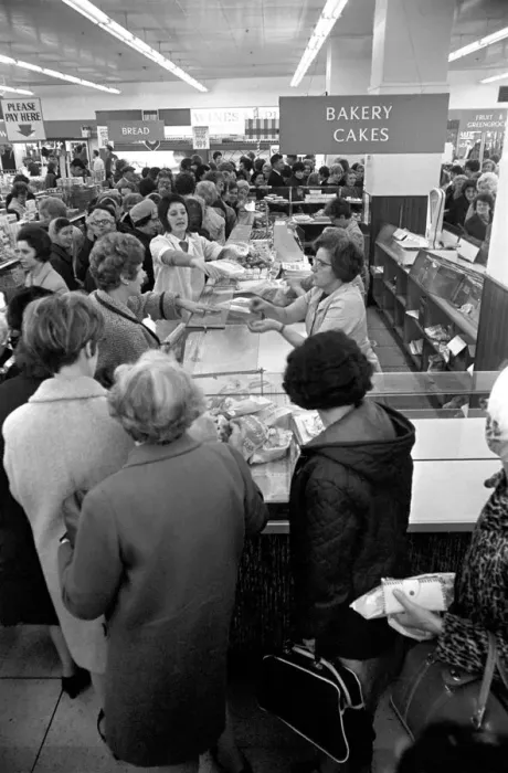 Framed Print : Food: Industrial Disputes: Scores of shoppers line the counter at Lewis