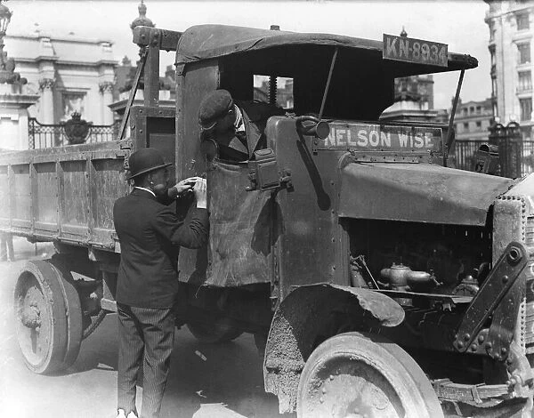 Food transport driver seen here getting his instructions at the Hyde Park transport depot