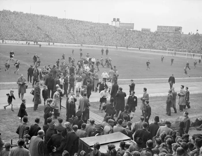 Framed Print : Football 1954  /  55 Season. Large crowds and photographers gather on the pitch at Stamford