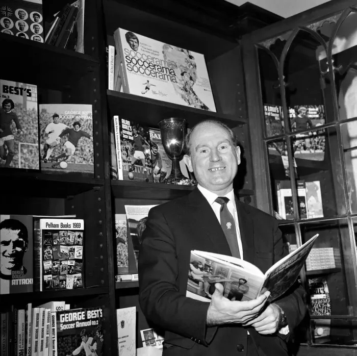Framed Print : Football agent Ken Stanley reading a George Best annual. 18th February 1970 Framed Print : Football agent Ken Stanley reading a George Best annual. 18th February 1970