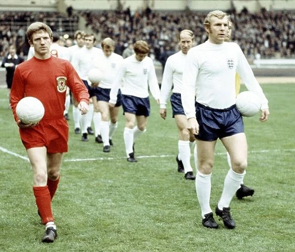 Football England v Wales 1969 Alan Durban and Bobby Moore lead out their teams