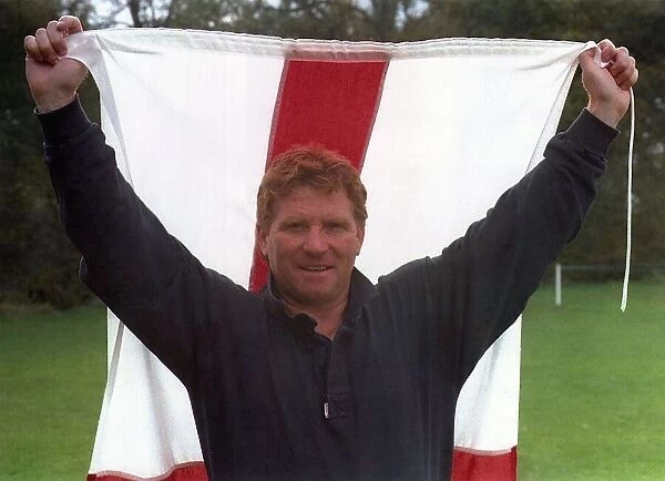 Football Manager Alan Ball holding St Georges Cross flag
