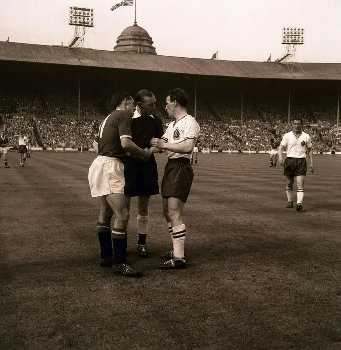 Framed Print : two football players from bolton wanderers and manchester united shake hands during Framed Print : two football players from bolton wanderers and manchester united shake hands during