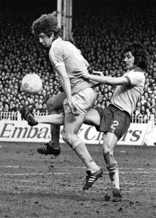Framed Print : Football - unusual: Brian Kidd of Manchester City gets a kick through his legs by Ipswich