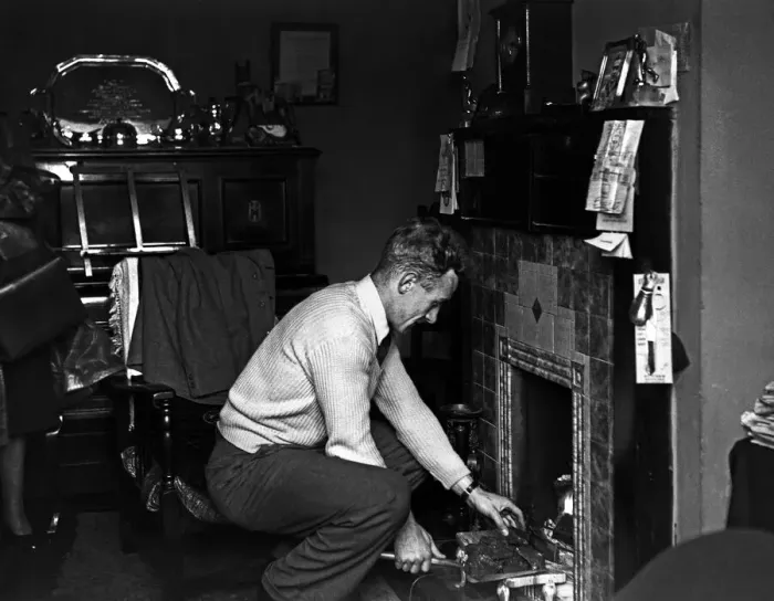 Framed Print : Footballer Billy Wright Wolves and England captain seen here putting coal on the fire Framed Print : Footballer Billy Wright Wolves and England captain seen here putting coal on the fire