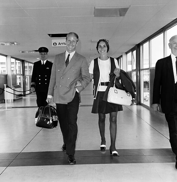 Footballer Bobby Charlton and his wife Norma leaving Heathrow Airport for Australia