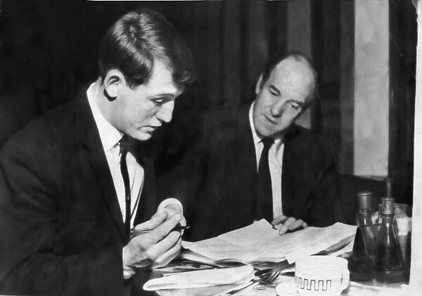Footballer Brian Clark pictured signing for Cardiff City with manager Jimmy Scoular