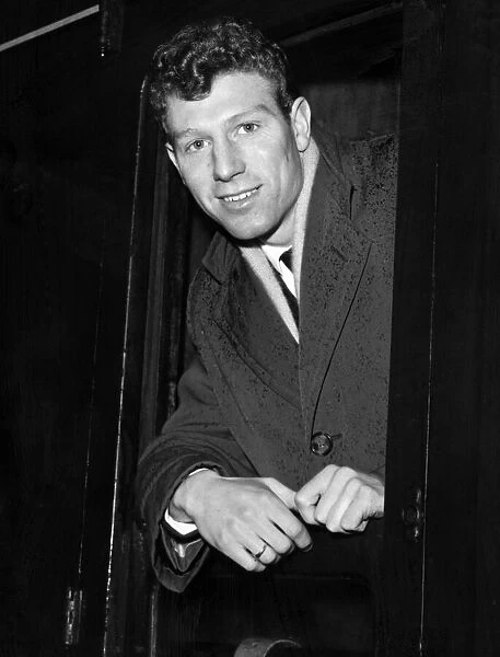 Footballer Colin Grainger aboard the train at Sheffield Station. 4th February 1957