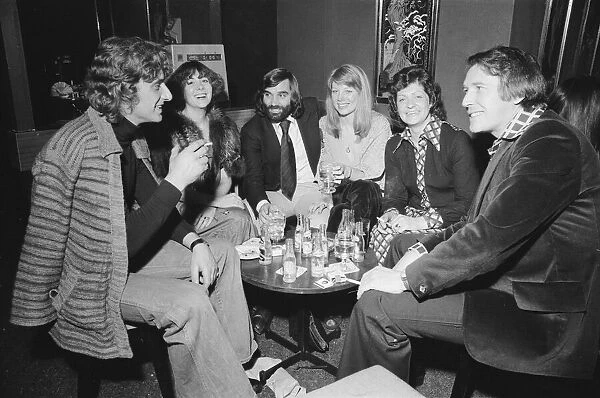 Footballer George Best with friends at his night club Slack Alice in Manchester