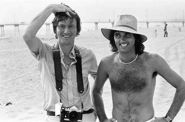 Footballer George Best poses on the beach withDaily Mirror Staff Photographer Kent Gavin