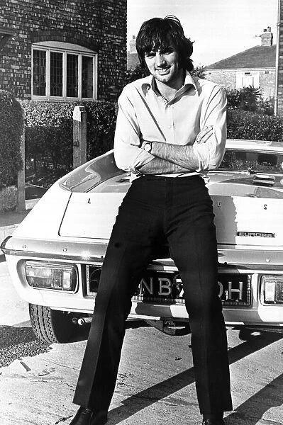 Footballer George Best seen here outside his Manchester home leaning against his new car