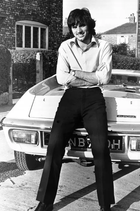 Framed Print : Footballer George Best seen here outside his Manchester home leaning against his new car