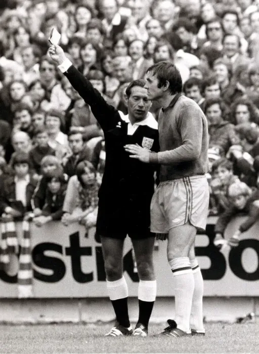 Framed Print : Footballer Jimmy Rimmer is booked by referee for marking the pitch