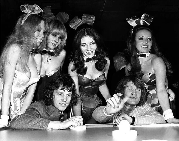 Footballer Mick Shannon (left) playing Rodney Marsh at air hockey at The Playboy Club in