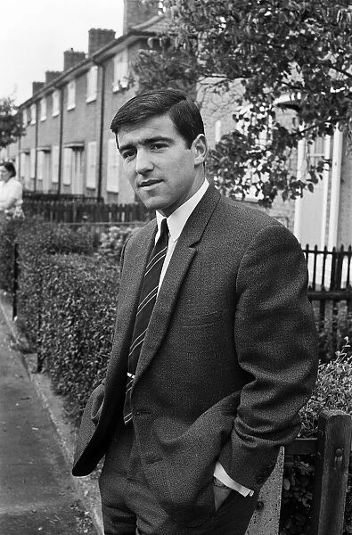 Footballer Terry Venables on his way to work using public transport in London