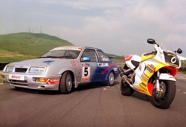 Ford Sierra Cosworth in racing trim with a Honda motorbike. July 1999