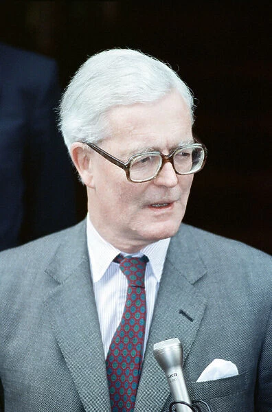 Foreign Secretary Douglas Hurd on the steps on the Foreign Office announcing his
