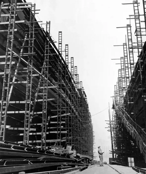 Framed Print : A foreman checks area under construction and area completed on new liners being