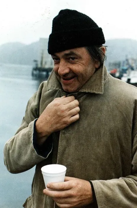 Framed Print : Bill Forsyth film director collar of coat turned up woollen hat paper cup on quayside