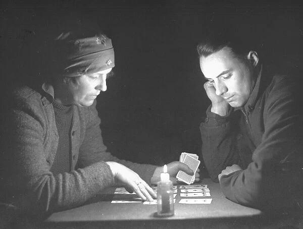 Fortune teller seen here reading the cards. January 1934
