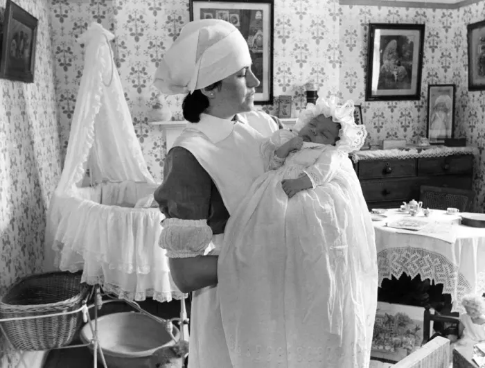 Framed Print : Fran Mileman and her eight week old baby Alexander in the nursery at Beamish Museum Framed Print : Fran Mileman and her eight week old baby Alexander in the nursery at Beamish Museum