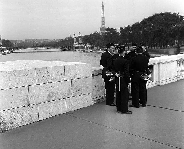 France Paris -Gendarms on standby talk among themselves on a bridge over the River Seine
