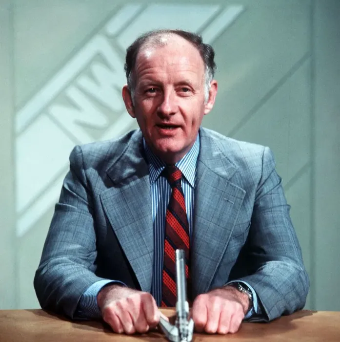 Framed Print : Frank Bough TV Presenter sitting at desk reading news Framed Print : Frank Bough TV Presenter sitting at desk reading news
