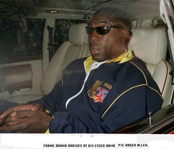 Frank Bruno arriving back at his Essex home after his defeat by Mike Tyson for the WBC