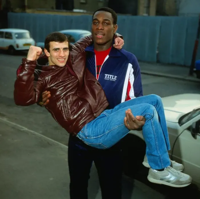 Framed Print : Frank Bruno boxer 1983 lifting and holding Charlie Magri Framed Print : Frank Bruno boxer 1983 lifting and holding Charlie Magri