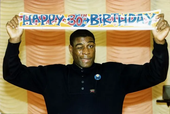 Framed Print : Frank Bruno boxer holding happy birthday poster above head Framed Print : Frank Bruno boxer holding happy birthday poster above head