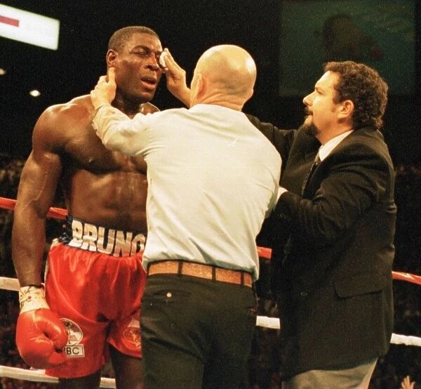 Frank Bruno gets attention at the end of the fight after his defeat in three