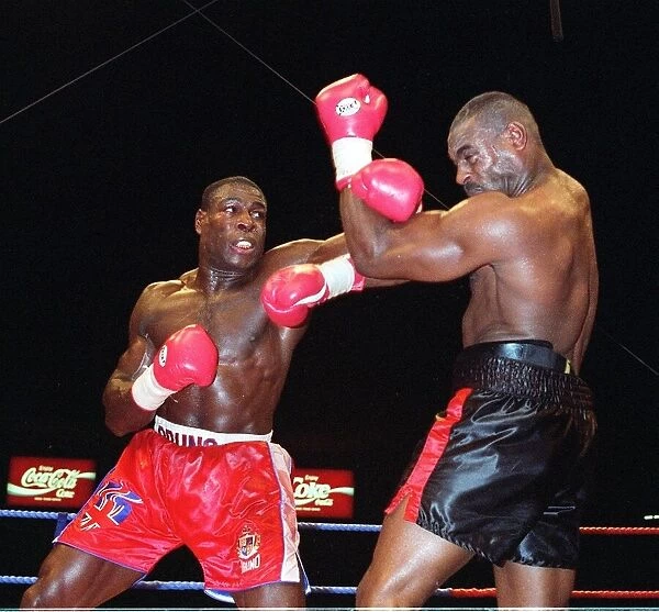 Frank Bruno lands another punch to the head of Oliver McCall in his WBC championship