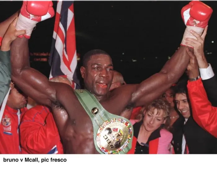 Framed Print : Frank Bruno raises his arms in jubilation after defeating Oliver McCall at Wembley