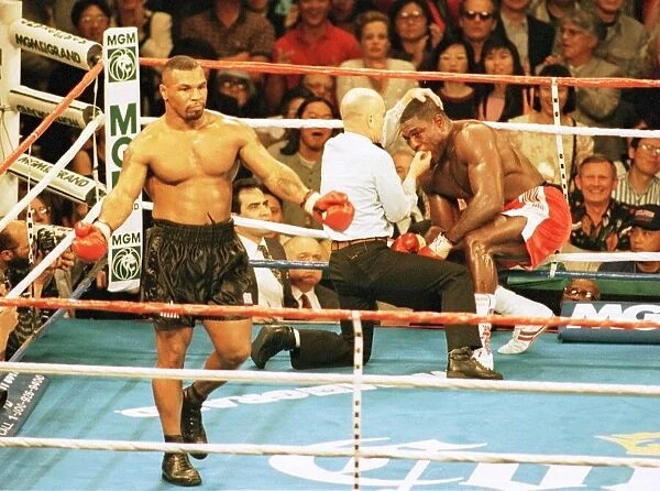 Frank Bruno is stopped by the referee in the 3rd round against Mike Tyson in his