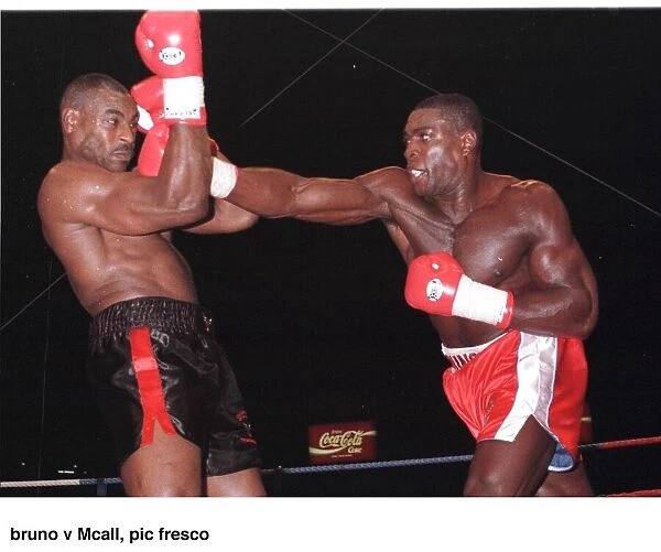 Frank Bruno strikes Oliver McCall with a right cross during their fight at Wembley