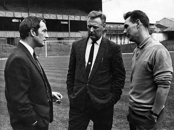 Frank Clough, talks to Derby County manager, Brian Clough (right) and his right hand man