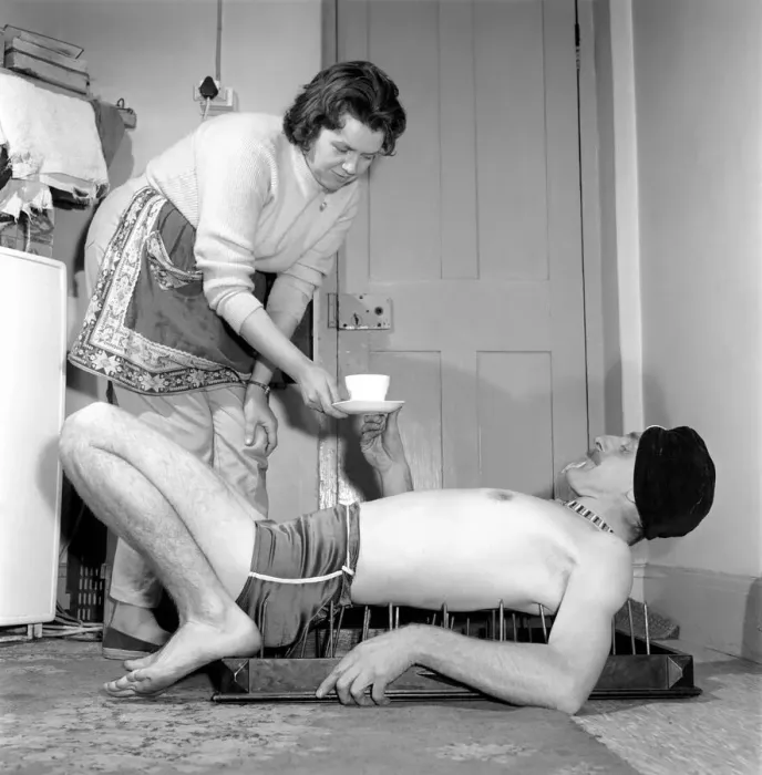 Framed Print : Frank Pepper, Fakir seen here laying on a bed of nails whilst enjoying a cup of tea Framed Print : Frank Pepper, Fakir seen here laying on a bed of nails whilst enjoying a cup of tea