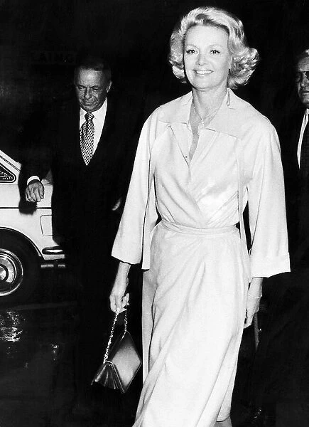 Frank Sinatra and his girlfriend barbara marx on the way to a restaurant