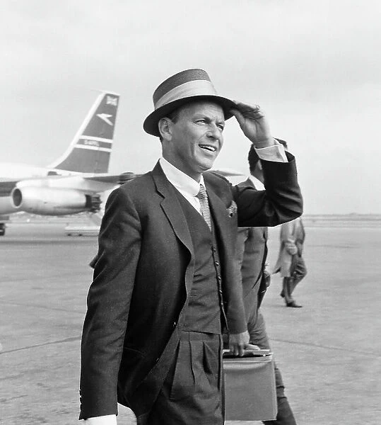 Frank Sinatra seen here arriving at Heathrow airport in the summer of 1961