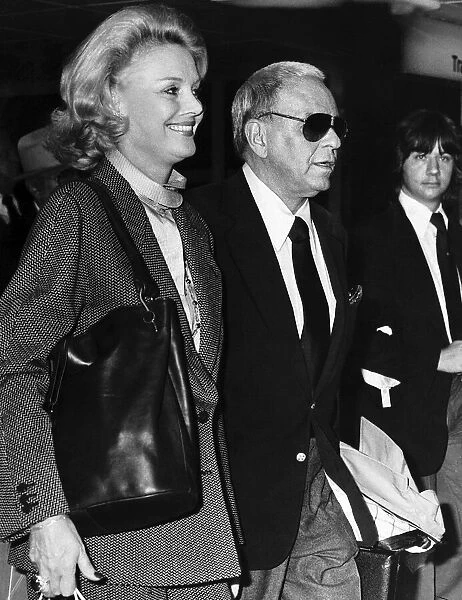 Frank Sinatra Singer with wife leaving Heathrow Airport