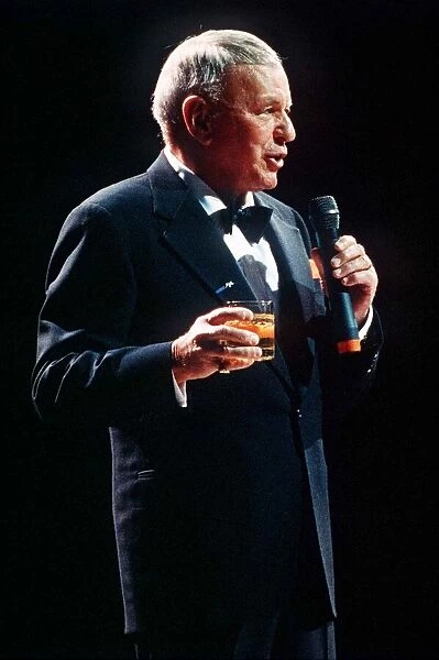 Frank Sinatra sings in concert with drink in hand