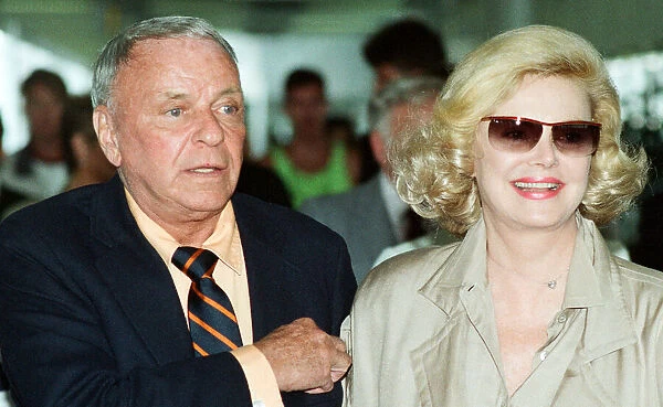 Frank Sinatra and wife Barbara Marx seen here arriving at Heathrow Airport 28th June 1990